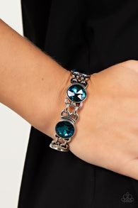 "Devoted To Drama" Silver metal Sapphire Blue Rhinestone Stretch Bracelet