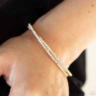 "Iridescently Intertwined" Gold Metal Twisted White Rhinestone Flexible Cuff bracelet.