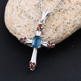 Platinum over Sterling Silver Garnet and London Blue Topaz Cross Pendant and 20" Chain