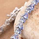 Platinum over Sterling Silver 7.8cts Tanzanite Trillion and Round Line Bracelet (8.00 in)