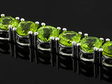 Rhodium/Sterling Silver 27cts. Vibrant Green PERIDOT Tennis Bracelet (Size 7.25")